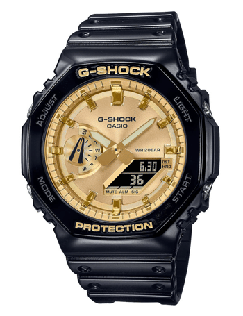 Sort og guld Casio G-Shock ur, analog/digital, oktagonal kant, vandtæt op til 20 bar.