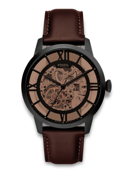Fossil Townsman ur med skeletdial og brun læderrem, der viser urets indre mekanik.