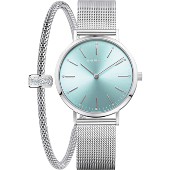 Dameur med lys blå urskive, mesh-armbånd. Armbånd med sten.