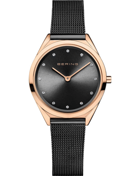 Elegant Bering dameur med sort urskive, guldfarvet urkasse og sort mesh-rem.