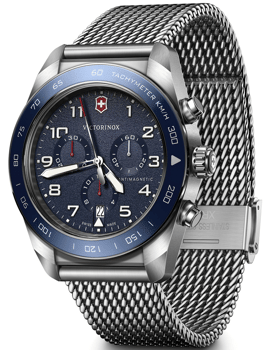 Victorinox herreur med blå urskive, tachymeter-bezel og metal mesh-armbånd.